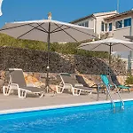 Four-bedroom In Casa vacanze